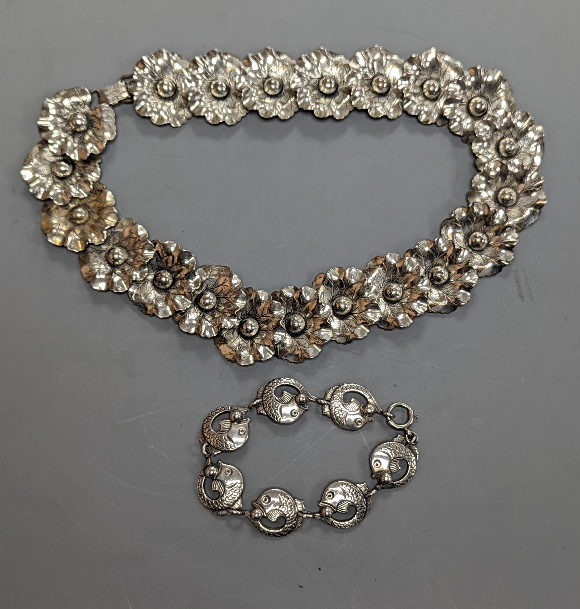 A Danecraft sterling flower head link necklace, 42cm and a Danish sterling fish link bracelet.
